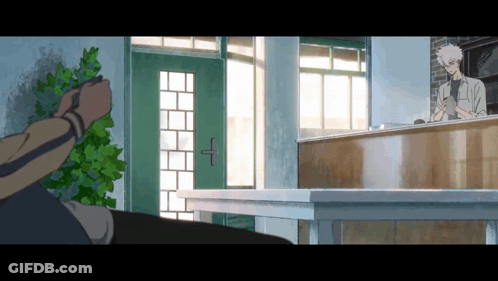 Man Standing In Front Of Counter With Green Door GIF