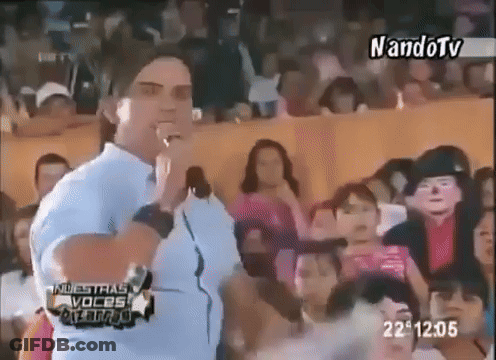 Man Standing In Front Of Crowd At 22:05 GIF