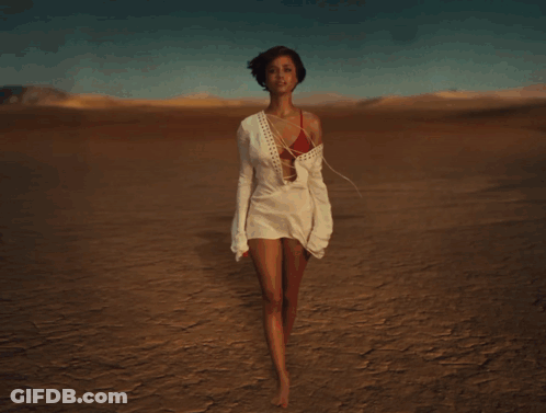 Man Standing In Front Of Desert Explosion GIF