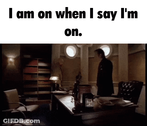 Man Standing In Front Of Desk Saying I Am On GIF