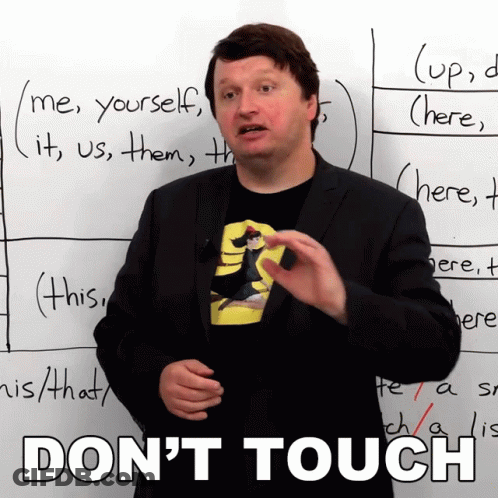 Man Standing In Front Of Do Not Touch Sign GIF