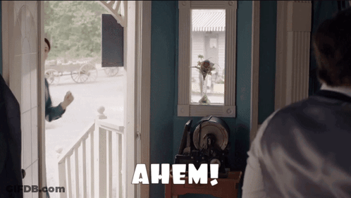 Man Standing In Front Of Door Saying Ahem GIF
