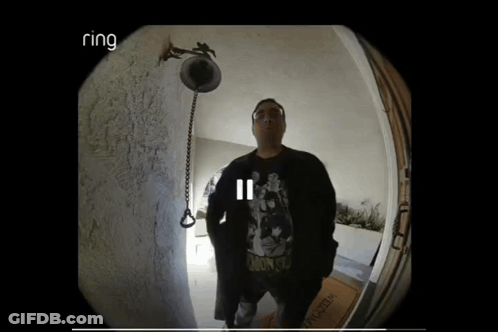 Man Standing In Front Of Door With Ring Logo GIF
