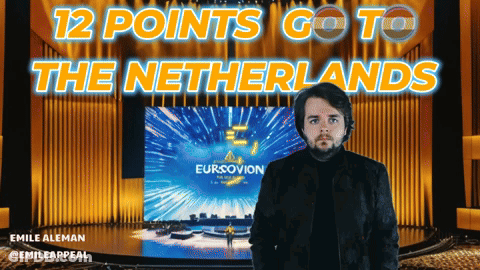 Man Standing In Front Of Eurovision Screen GIF