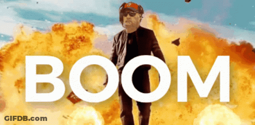 Man Standing In Front Of Explosion Saying Boom GIF