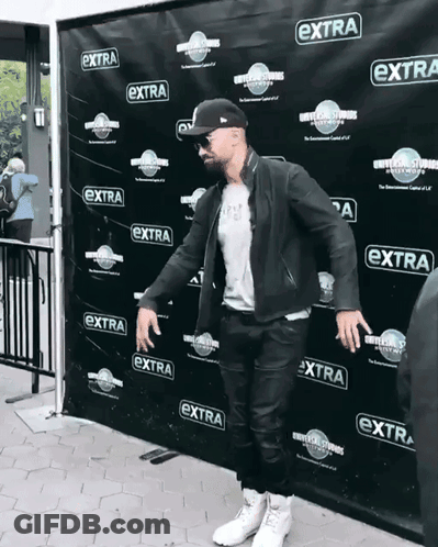 Man Standing In Front Of Extra Wall GIF