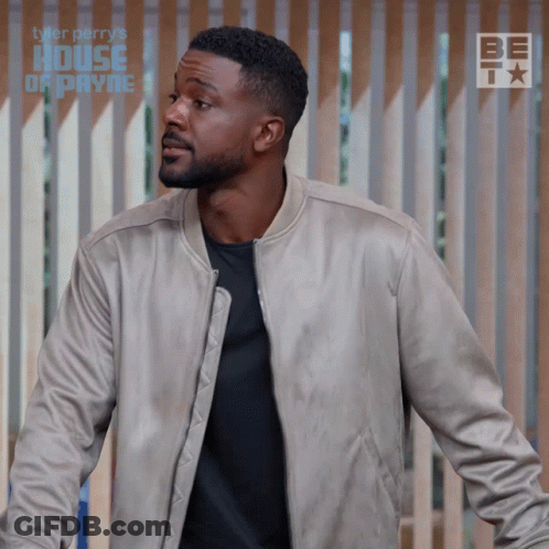 Man Standing In Front Of Fence With Tyler Perry's House Of Payne GIF