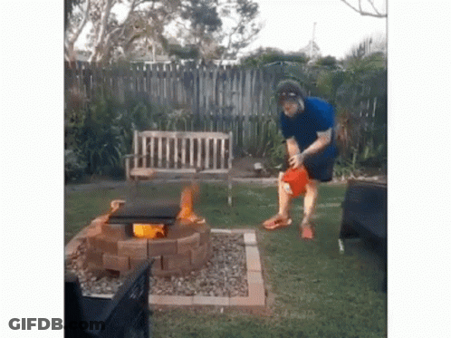 Man Standing In Front Of Fire Pit GIF