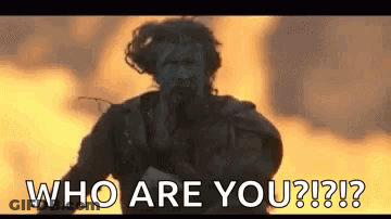 Man Standing In Front Of Fire Saying Who Are You GIF