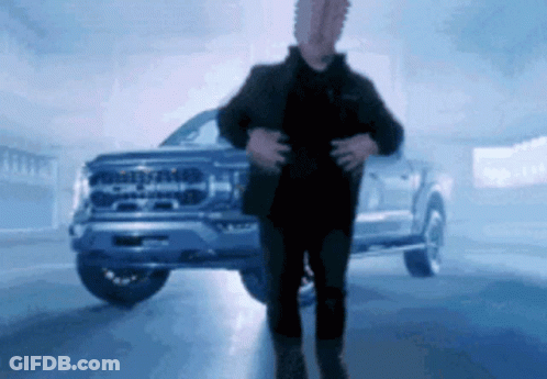 Man Standing In Front Of Ford Truck GIF
