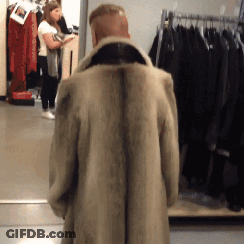 Man Standing In Front Of Fur Coat GIF