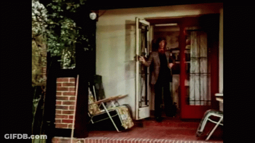 Man Standing In Front Of Glass Door GIF