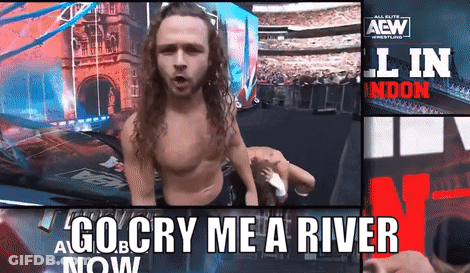 Man Standing In Front Of Go Cry Me A River Now Sign GIF