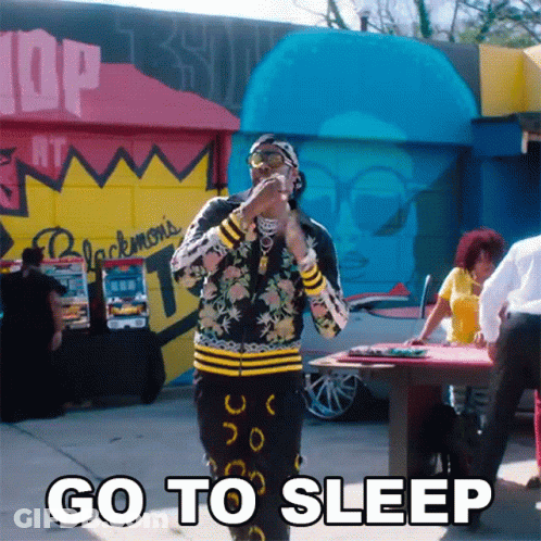 Man Standing In Front Of Go To Sleep Building GIF