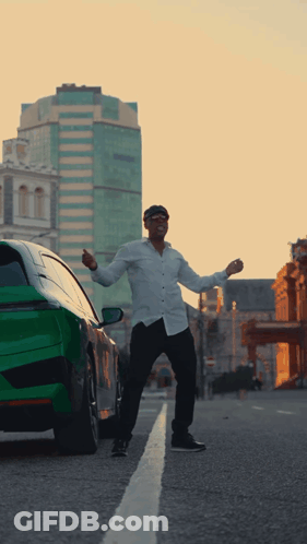 Man Standing In Front Of Green Car GIF