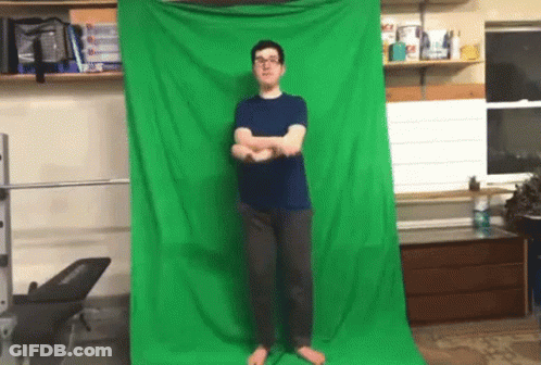 Man Standing In Front Of Green Screen GIF