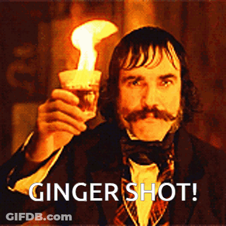 Man Standing In Front Of Green Wall With Gingerlife GIF