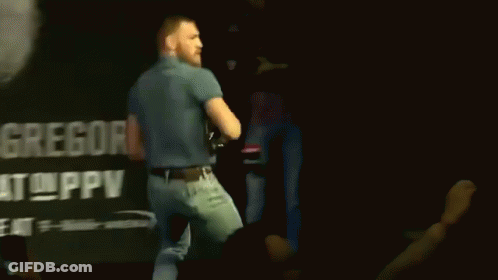 Man Standing In Front Of Gregor Sign GIF