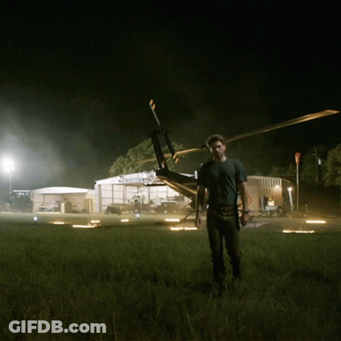 Man Standing In Front Of Helicopter GIF