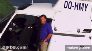 Man Standing In Front Of Helicopter DQ-HMY GIF
