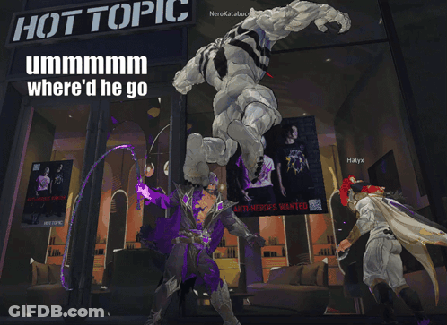 Man Standing In Front Of Hot Topic GIF