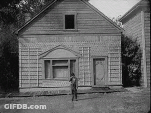Man Standing In Front Of House GIF