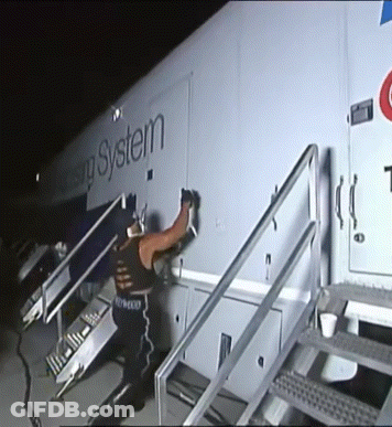 Man Standing In Front Of Housing System Trailer GIF