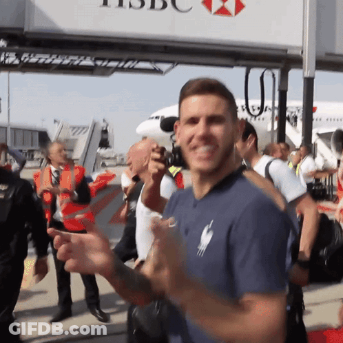Man Standing In Front Of HSBC Sign GIF