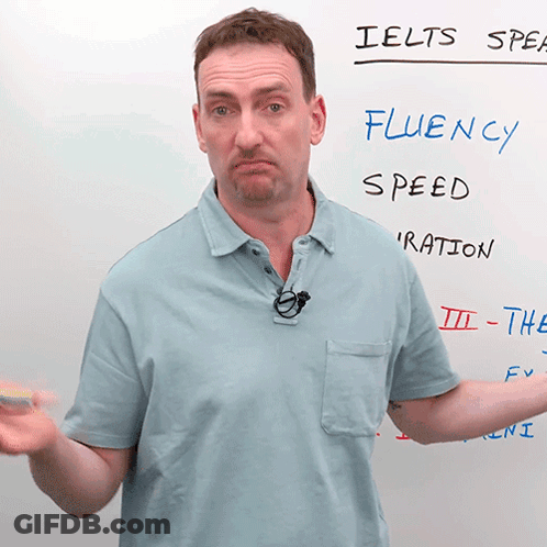 Man Standing In Front Of IELTS Speak Whiteboard GIF