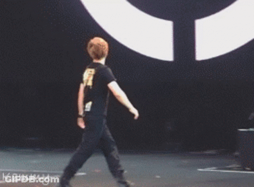 Man Standing In Front Of Kammy Drum Set GIF