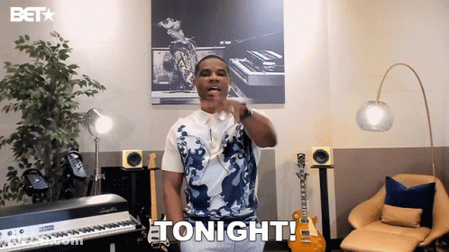 Man Standing In Front Of Keyboard And Guitar Saying Tonight GIF