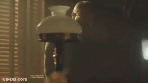 Man Standing In Front Of Lamp GIF