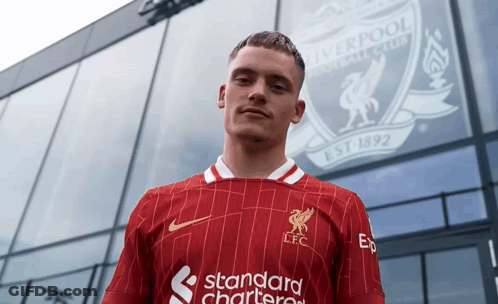Man Standing In Front Of Liverpool Building GIF