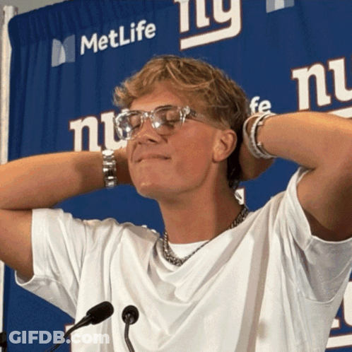 Man Standing In Front Of MetLife Sign GIF
