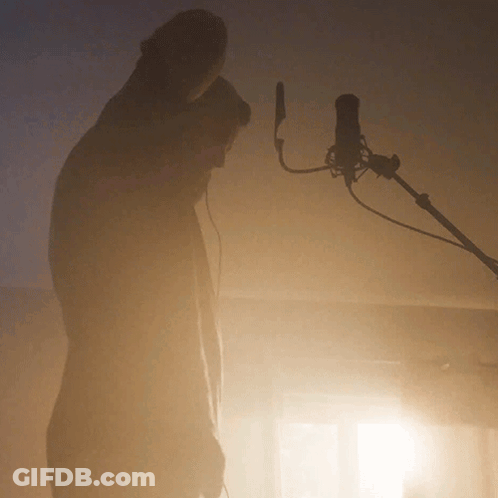 Man Standing In Front Of Microphone GIF