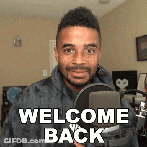 Man Standing In Front Of Microphone Welcome Back GIF