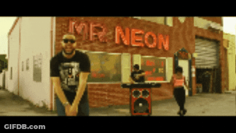 Man Standing In Front Of Neon Sign GIF