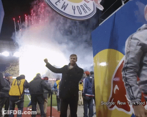 Man Standing In Front Of New York Sign GIF