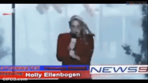 Man Standing In Front Of News Banner GIF