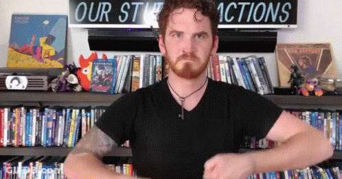 Man Standing In Front Of Our Stuck Actions Sign GIF
