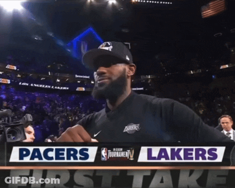 Man Standing In Front Of Pacers And Lakers Sign GIF