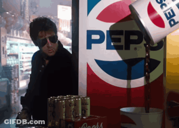 Man Standing In Front Of Pepsi Advertisement GIF