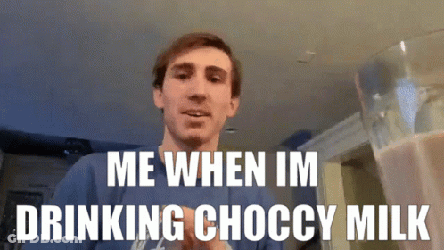 Man Standing In Front Of Pitcher Of Choccy Milk GIF
