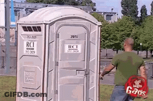 Man Standing In Front Of Portable Toilet Saying RCI GIF