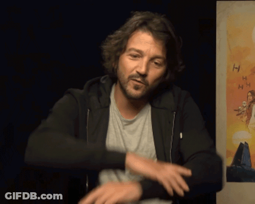 Man Standing In Front Of Poster Saying HH GIF