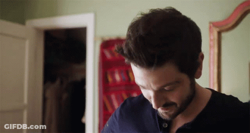 Man Standing In Front Of Poster Saying HH GIF