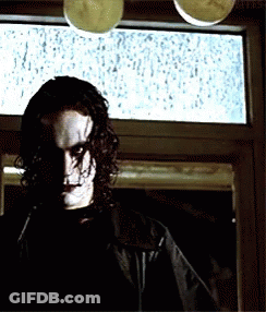 Man Standing In Front Of Rainy Window GIF