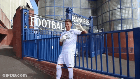 Man Standing In Front Of Rangers Sign GIF