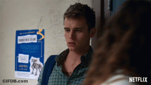 Man Standing In Front Of Robotics Club Sign GIF