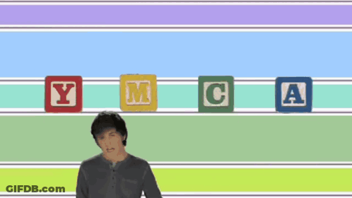 Man Standing In Front Of Robots With YMCA GIF